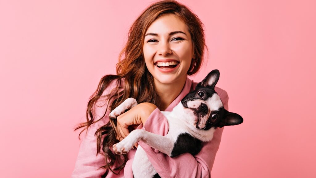 ESTES signos têm a conexão mais forte com cães Menina segurando cachorrinho