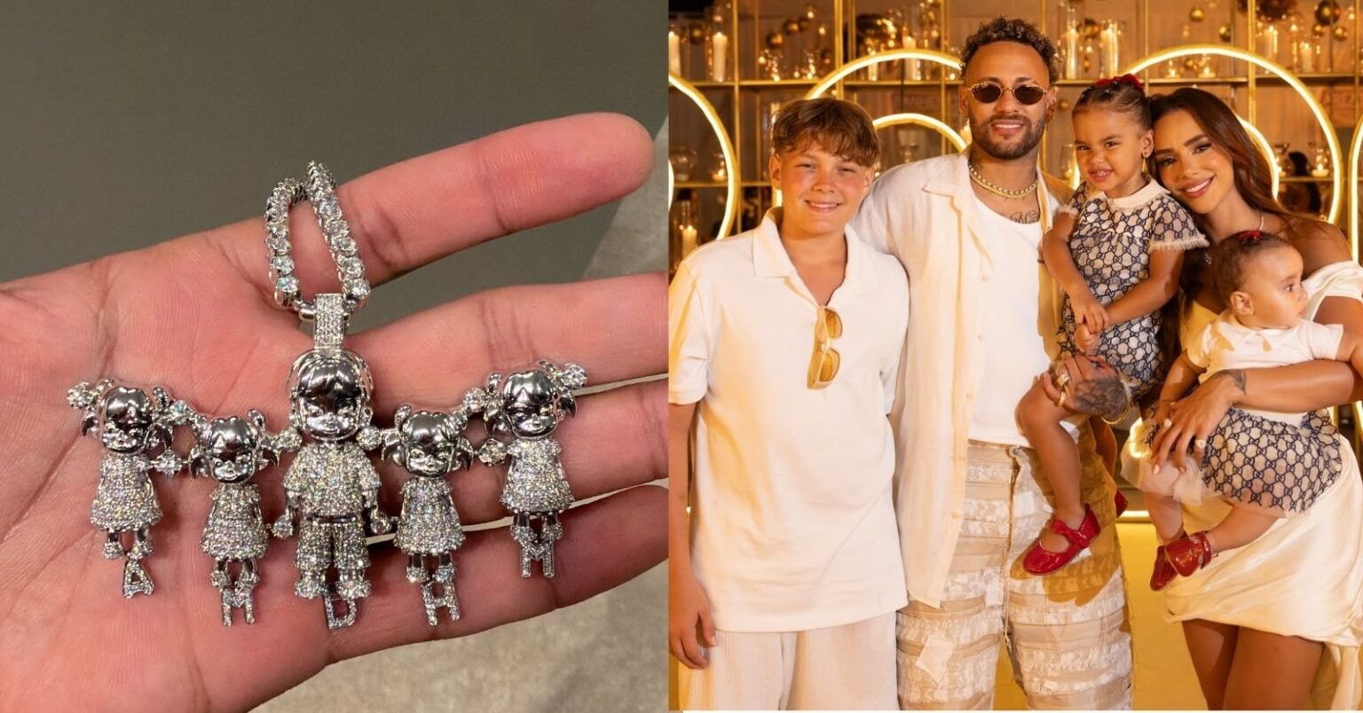 Pingente de Neymar com inicial ‘A’ chama atenção e intriga seguidores; entenda Pingente de Neymar com bonecos representando os filhos ao lado de foto do jogador com Bruna Biancardi e as crianças em evento familiar.