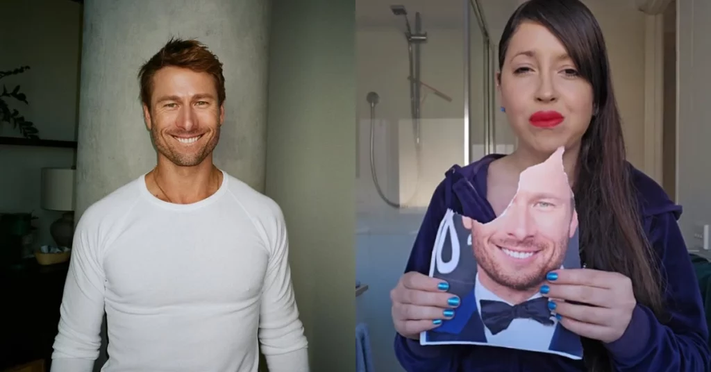 Glen Powell aparece sorrindo ao lado de fã que segura foto impressa do ator com parte do papel rasgado