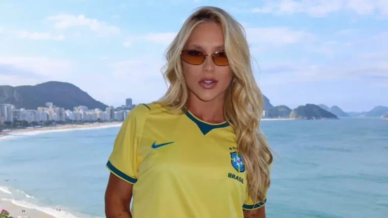 Após xingamentos, Virginia falta a festa de famosos após jogo do Brasil; entenda Virginia Fonseca posa com camisa da Seleção Brasileira diante da vista da orla do Rio de Janeiro antes do jogo no Maracanã.