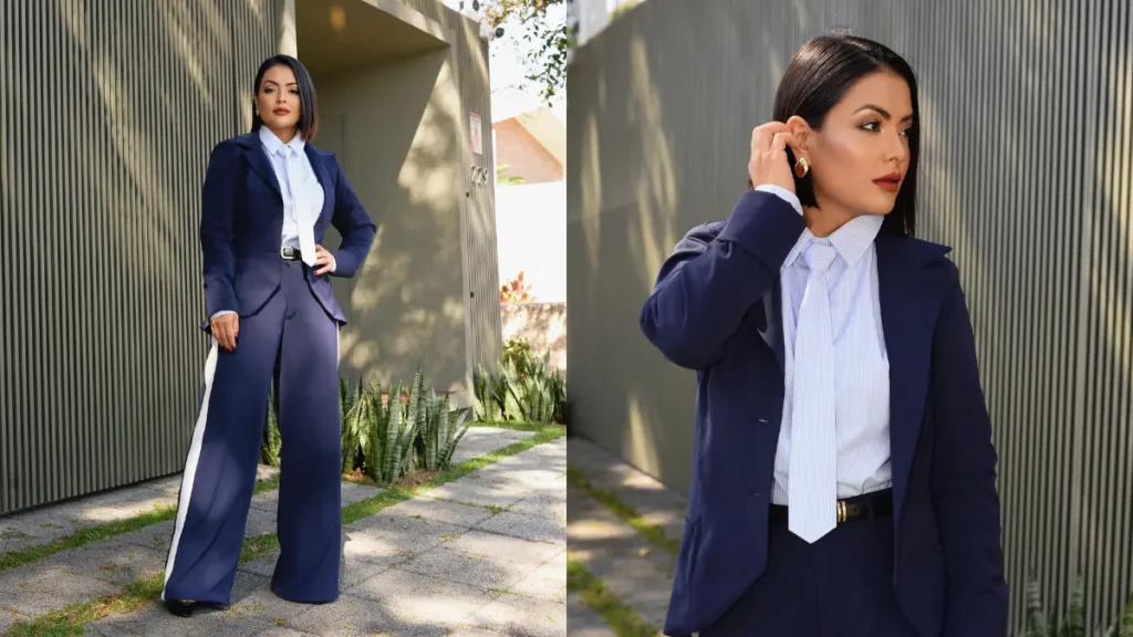 Li Martins, ex-Rouge, posa usando um conjunto azul-marinho em área externa.