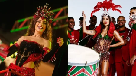 Anitta aparece caracterizada como rainha de bateria da Grande Rio em duas imagens, usando fantasias vermelha, preta e verde e posando ao lado de integrantes da escola de samba.