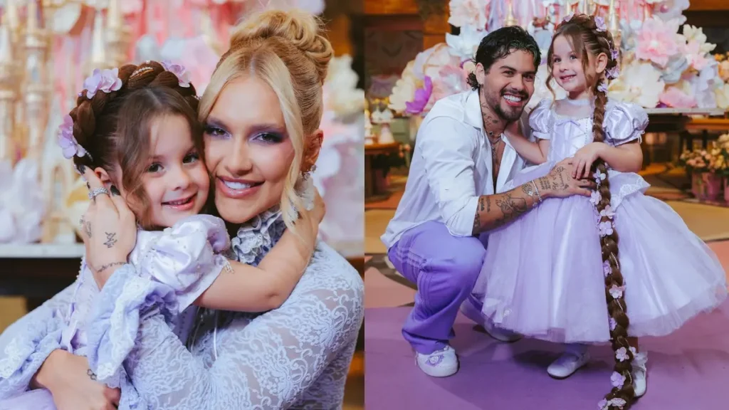 Virginia Fonseca abraça Maria Flor, que usa vestido lilás e tiara de flores, durante a festa de 4 anos da menina. Ao lado, Zé Felipe aparece agachado e sorrindo enquanto segura a filha.